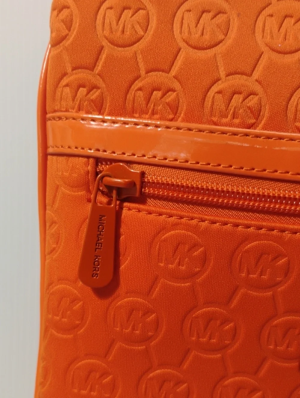 Michael Kors Neoprene Tangerine Mono Embossed Swing Crossbody bag